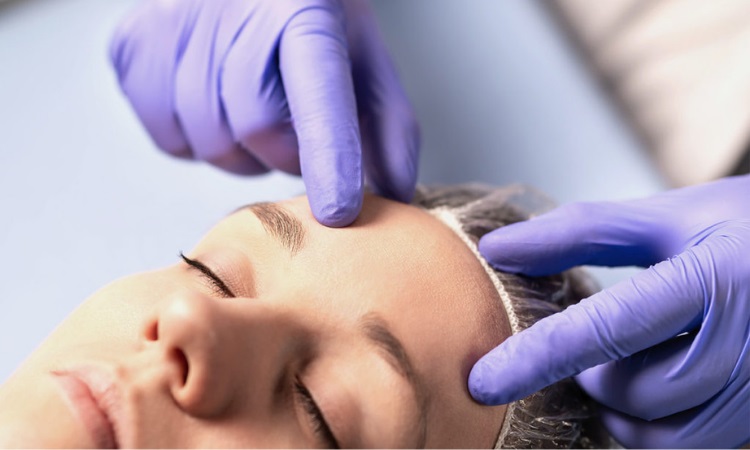 A close-up of hands touching a person's foreheadAI-generated content may be incorrect.