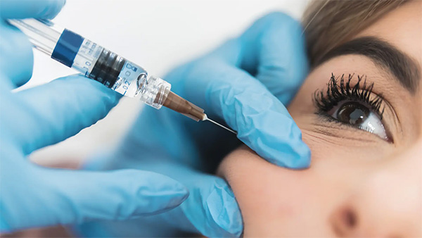 A close-up of a person getting an injectionAI-generated content may be incorrect.